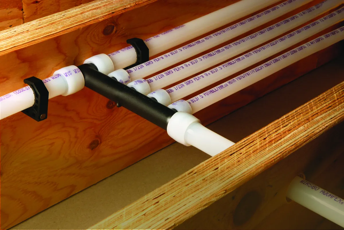 PEX multiport tee mounted across floor joists – What to Expect From a Navien Tankless Water Heater Installation for Laguna Hills, CA homes